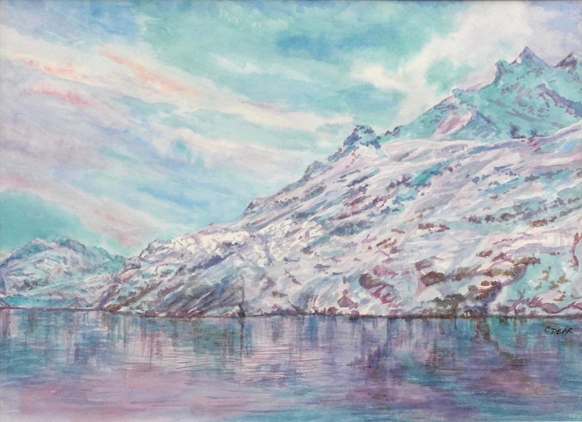 Winter scene depicting snowy mountain and lake